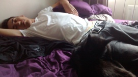 Kato asleep cuddling with Rufus the cat